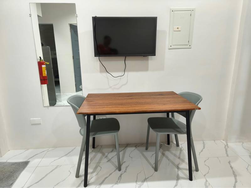 Condo dining area with TV — 2020 Housing Unit 1